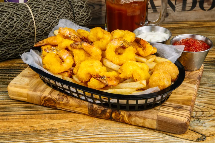 Golden fried shrimp with fries and dipping sauce